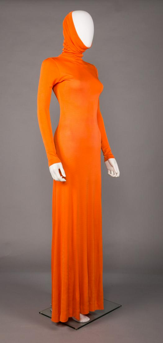 STEPHEN BURROWS ORANGE JERSEY MAXI DRESS, 1968: 1968 giraffe neck orange jersey maxi dress w/ long sleeve, labeled "Stephen Burrows for O (Boutique)", B 36", W 32", H 36", L 59", Neck 27", (tiny light stains in right side leg, left cuff, right side