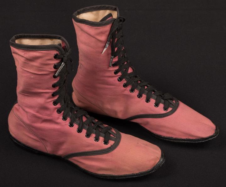RARE EARLY KEDS, c. 1916: Mauve cotton high top, lace up shoes w/ rubber sole, lined in canvas, label "Keds" & "United States Rubber Co.", (some fading, light discoloration at toes, ankles & back of heel on left) excellent.