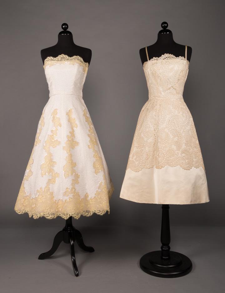 TWO CREAM & LACE PARTY DRESSES, 1950s: 2 1950s cream party dresses w/ fitted bodice & full skirt: 1 strapless linen w/ white vermicelli beading & lemon yellow inset lace, label "Brannell", B 34", W 25", CF L 41", excellent & 1 spaghetti st