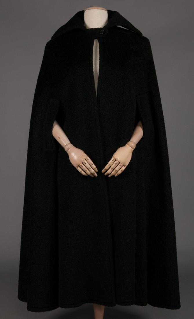 GALANOS MOHAIR WOOL CAPE, 1960s: Black full length w/ wide lapels, button & tab closure at CF, arm slits at hip, interior silk patch pocket right side, "Galanos", W, L 49", excellent. (Photos lightened for visibility) excellent.