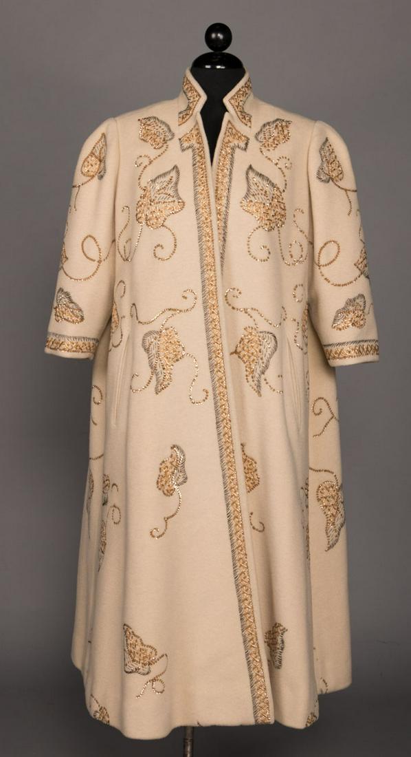 GOLD EMBROIDERED CASHMERE EVENING COAT, mid 20TH C.: Ivory cashmere w/ gold sequins & silver tinsel, leaf & vine design, notched collar, open front, bracelet length sleeves, 2 slit pockets at front Hs, silk lining, label "Originala Stroock" & "100% Kash