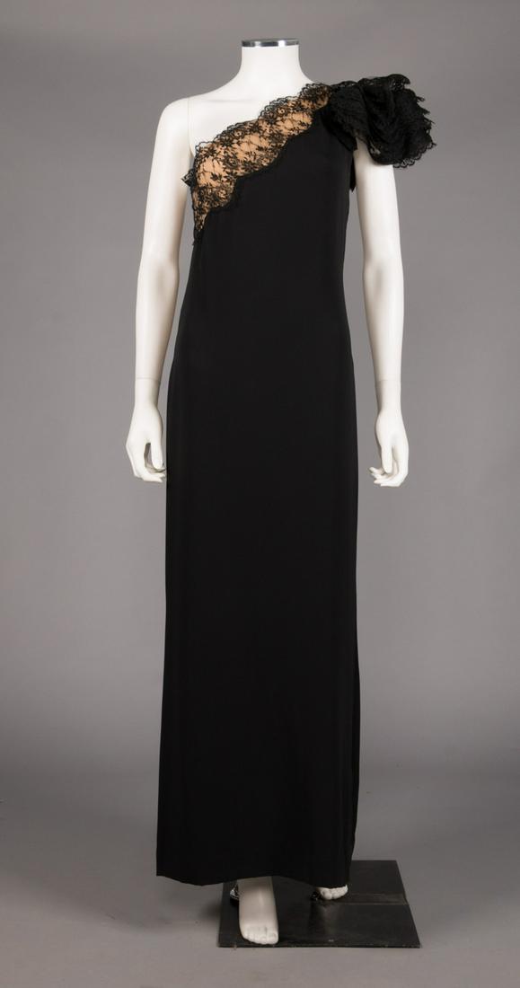 BILL BLASS SINGLE SHOULDER EVENING GOWN, c. 1990: Black silk evening gown w/ structured black lace cap to left SH & a-symmetrical black lace over ecru illusion panel across top & over B, label "Bill Blass", B 34", W 28", H 40", L 57", (some pulls) ve