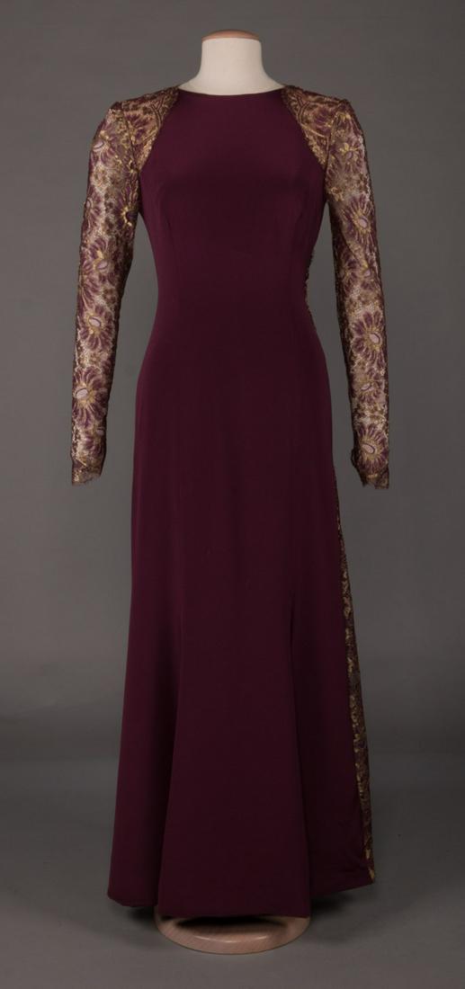 BILL BLASS PLUM EVENING SHEATH, AMERICA, 1990s: Plum long sleeved floor length evening dress w/ scoop neck & crisscross metallic gold lace back panel to front SHs, sleeves & gadot at left side seam, labeled "Bill Blass", B 36", W 30", L 58", excell