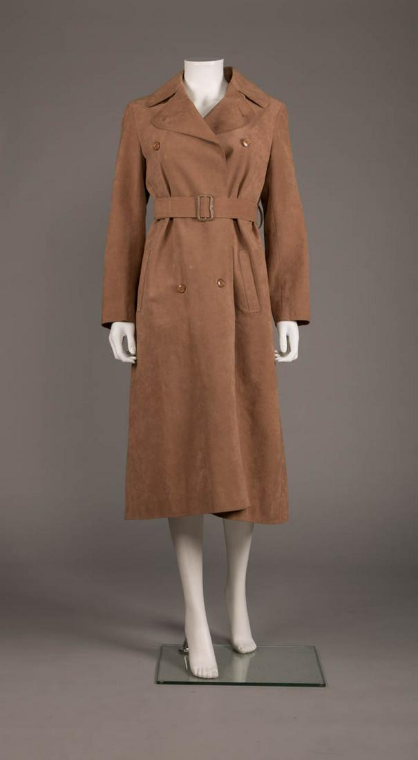 HALSTON FLIGHT ATTENDANT TRENCH COAT, 1970s: Ultra suede trench coat w/ wide notched cape collar, CF button closure, inset H pockets, self-belt tie closure, original removable quilted lining, purchased separately to be worn w/ Braniff Airline un