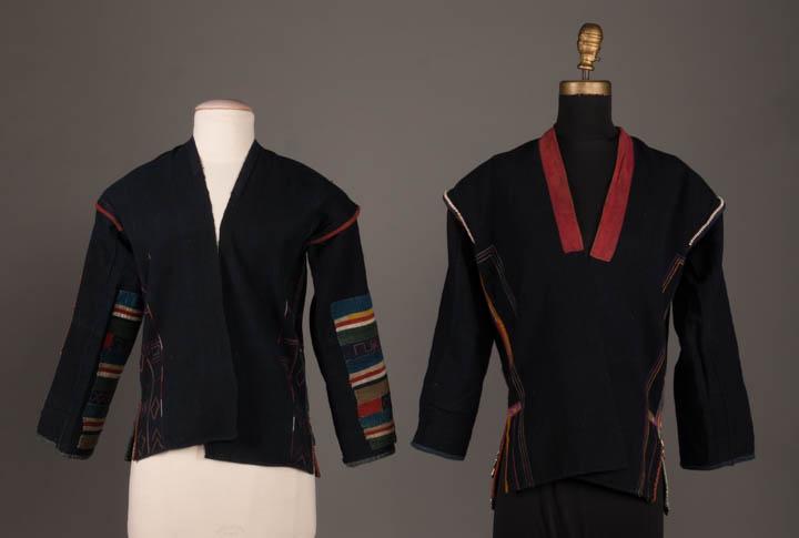 TWO INTRICATELY HAND EMBROIDERED SHIRTS, AKHA, 19TH C: Both indigo dyed heavy cotton: 1 w/ geometric pieced work in multicolor w/ intricate hand embroidered horizontal strips, decorative panels possibly from older garments, B 36", L 24.5" &1 hand embroide