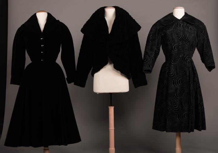 THREE BLACK EVENING JACKETS & COATS, AMERICA, 1951-1959: 1 calf-length evening coat in black silk velvet w/ shawl collar, fitted princess bodice, 3/4 length kimono sleeves w/ turn-back cuff, flared skirt w/ seam pockets & H pads, novelty cut jet CF button c