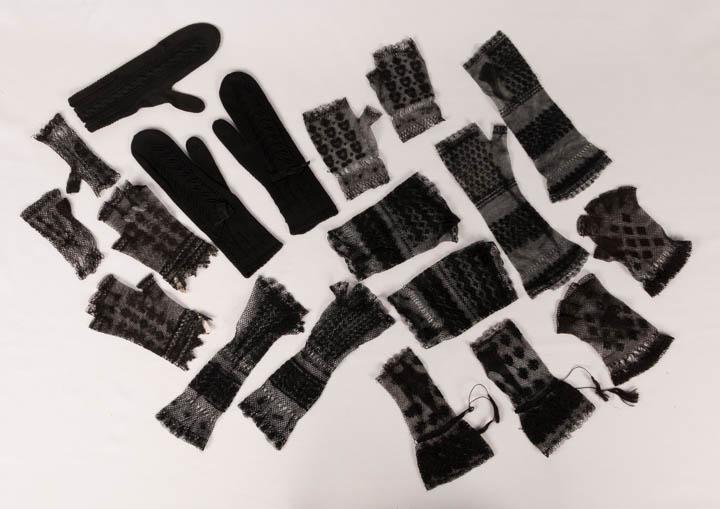 GENEROUS LOT OF BLACK MITTS & MITTENS, USA, 1840-1870s: 8 pair ladies netted mitts in a variety of floral & geometric patterns w/ openwork & embroidered elements; 1 pair knitted w/ bows at wrists, all L 5.5"- 10.5", all very good- excellent; t/w 1 single m