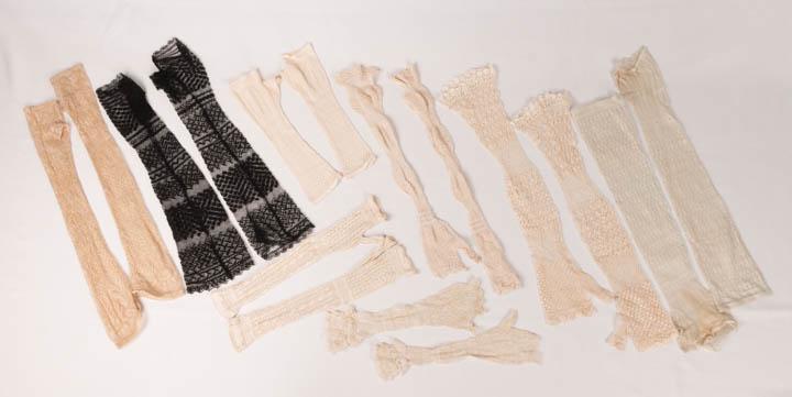 LADIES SILK MITTS, 1840-1870s: 8 pair silk knitted & netted ladies wrist & elbow length mitts w/ embroidered elements, all L 10.5"- 19", (some w/ light staining or small pulls) all good- excellent.
