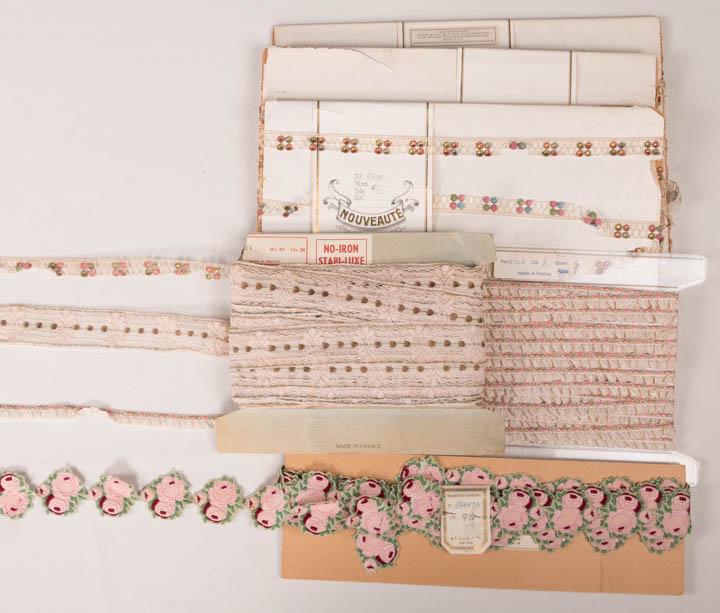 FLORAL TRIM YARDAGE, EARLY 20TH C: 1 pink rosettes Heilmann embroidery, 2.25" x 6 yds, 1 ft, 8"; 1 straw sequin & wooden bead florettes on net backing, "Made in France", 0.5" x 6 yds, 9; 1 of interlocking lame circles, 1.5" x 8 yds, 1 