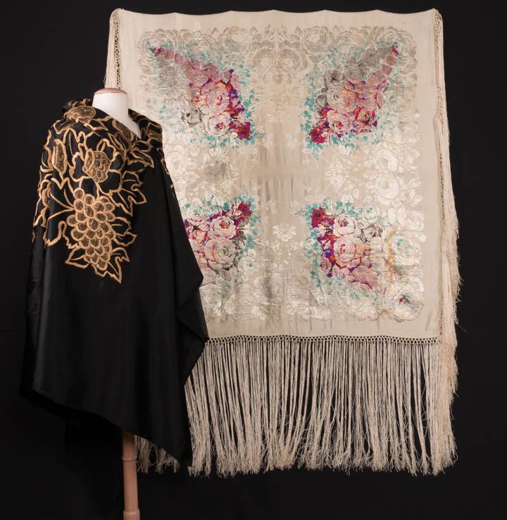 ONE LAME & ONE EMBROIDERED SHAWL, 1920-1930s: Silver lame Art Deco piano shawl w/ symetrical 4 quadrant jacquard shawl, overprinted in multicolored florals, silk fringe w/ intersperse metallic wrapped, labeled "B. Butterfield", 48" x 49" w/ 19" f