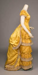 GOLDENROD SILK BUSTLED EVENING GOWN, c. 1880