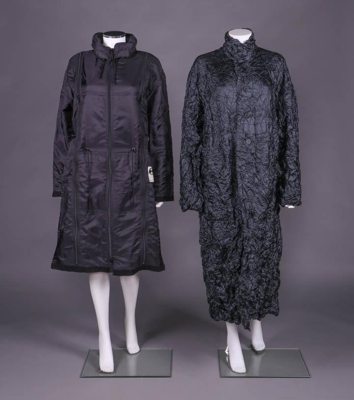 KOSUKE TSUMURA & ISSEY MIYAKE OVERCOATS, JAPAN,: 1 purple/black survival parka w/ vertical zipper compartments throughout including sleeves & back of hood, lined in black soft broadcloth, label "Final Home", B 48", L 42", (paint chipping CF zip pull
