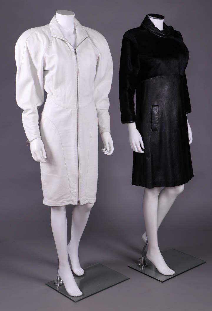 TWO LEATHER COAT DRESSES, SAN FRANCISCO, 1960s & 1980s: 1 white leather coat dress w/ full length strong SH sleeve, zip closure at cuff & CF, elaborately pieced W front & back, 1982-1986, label "Michael Hoban for North Beach Leather", B 41", W 27.5", L 40.