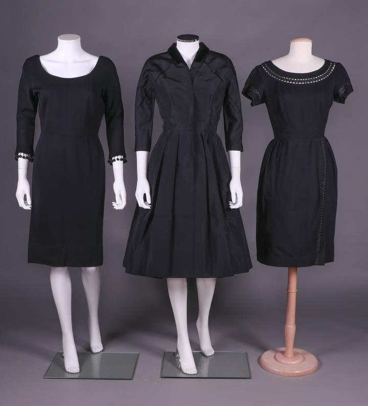 THREE BLACK DRESSES, AMERICA, MID 1950s-1967: 1 wool jersey w/ 3/4 length sleeve, scoop neckline, piped edging, dolman sleeve w/ gusset & baubles to cuffs, c. 1967, patent medallion "Webster Co.", B 39", W 25.5", L 40.5", (minor pilling in lap); 