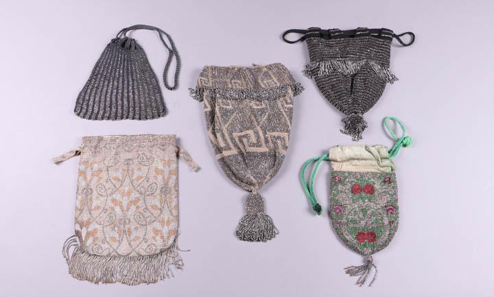 FIVE BEADED POUCH BAGS, 1880-1920: 1 dark grey crochet w/ steel cut beads, 7" x 7", (beads rusting near bottom, holes near bottom, 1 loop for drawstring casing torn); 1 woven w/ floral arabesques, 7" x 9" w/ 2" fringe, (bead loss & tar