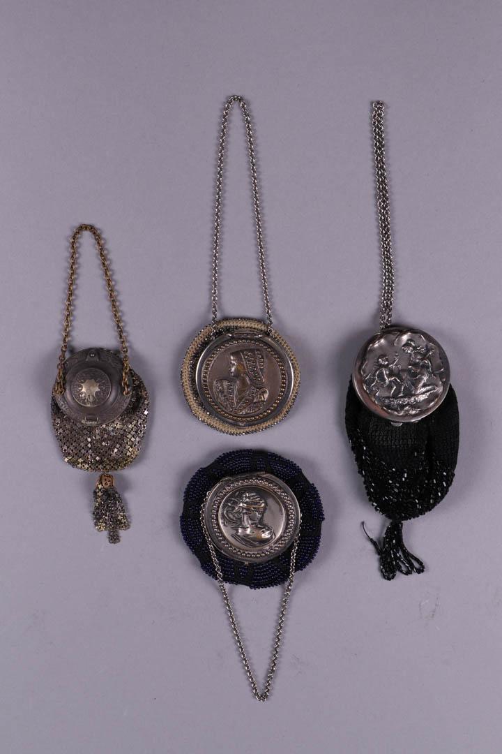 FOUR POUCH PURSES W/ EMBOSSED MEDALLION LIDS, c. 1900: All pouch style w/ medallion lids: 1 armor mesh w/ embossed lid in stylized floral & foliate motif, Wd 1.75", L 1.75", Ht 5", (tarnished & oxidizing); 1 black crochet w/ black beads & Cupid & Psyche, 