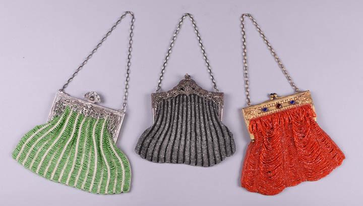 THREE BEADED FRAME BAGS, 1890-1920: All knitted & w/ Czech beads: 1 green beaded w/ Gaudi inspired white metal frame, stamped "Nic Silver", 8.5" x 6.75" x 0.5", (tarnished, unlined) very good; 1 black w/ clear beading & Gaudi inspired w