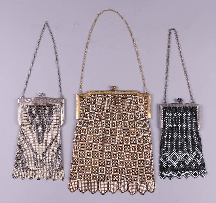 THREE BLACK & WHITE ENAMEL ARMOR MESH PURSES, AMERICA: 1925-1930s, All w/ pennant fringe & chain handles: 1 cream w/ black enamel & Art Deco white metal frame, stamped "Whiting & Davis", 3.75" x 6.75", (painted mail chipping, frame & chain tarnished); 1 b