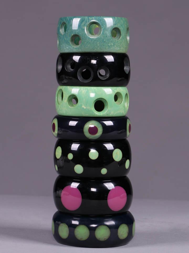 SIX BRUCE PANTTI DOT MOTIF BANGLES, AMERICA, MODERN: All signed "Pantti” & w/ circumference 7.75"-8": 3 w/ cut out & recessed dot motif: 1 marbled teal, Wd 1.5"; 1 black, Wd 1.25", (small-tiny chips to interior of carving); 1 marbled light green & cre