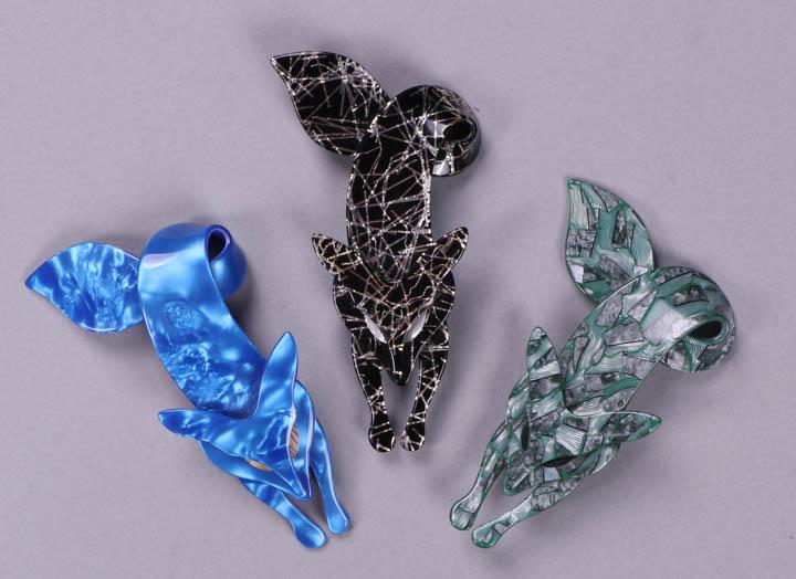 EIGHT LEA STEIN ANIMAL THEMED BROOCHES, PARIS, MODERN: All stamped on findings "Lea Stein, Paris": 3 Famous Fox brooches: 1 pearlized blue, 1 black w/ confetti & 1 green & grey, 2" x 4.25"; 2 Art Deco Cicada: 1 blue stripe & 1 clear w/ suspended teal & pu