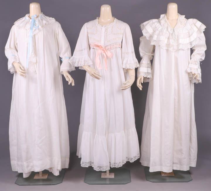 THREE PEIGNOIRS, c. 1900: 1 linen w/ tucked & lace trimmed collar to jabot front, fine let out tucking at CB, embroidered "Marthe", blue ribbon insertions at neck & cuff, B 50", L 53.5", (belt missing, 0.25" spot stains left c