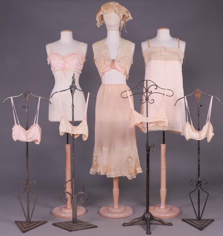 TEN PIECES OF PINK LINGERIE, 1920s: 1 silk crepe vest w/ Alencon lace, B 36", L 12.75"-16", (several tiny holes); 1 bra w/ lace straps, B 30", L 12", (light 0.5" dark stain right B dart); 1 peach bra, B 28", L 12.5", (fraying to lace & 