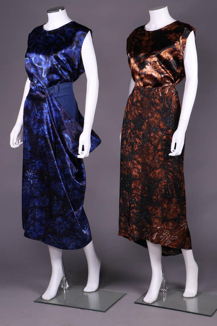 TWO YOHJI YAMAMOTO ENSEMBLES, JAPAN, 1980-1990s: All w/ label "Yohji Yamamoto": 2 sleeveless tunic w/ scoop neck: 1 cosmic clouds motif in shades of blue & black, B 44.5", L 28.5"; 1 rooster & leaf motif in shades of brown & gold, B 43.5", L 29";1 b