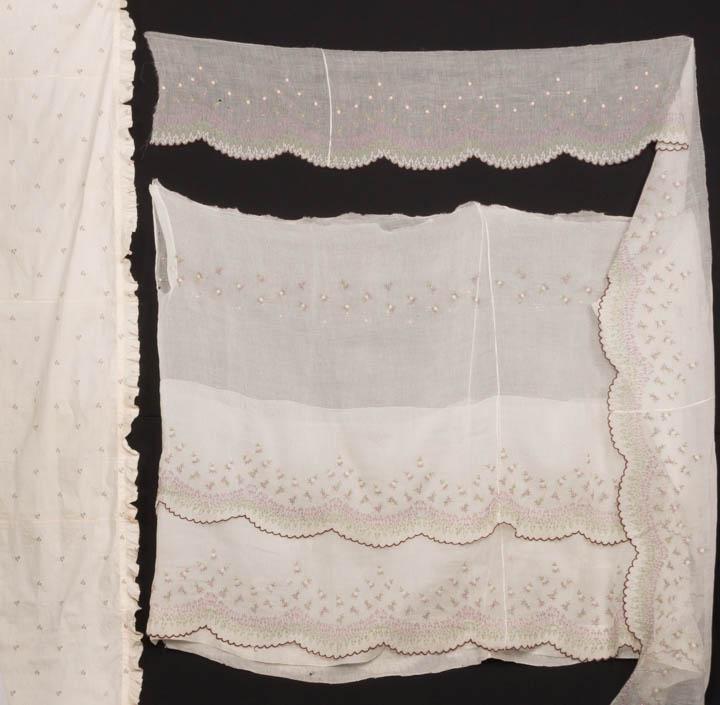 ONE SKIRT & ONE SHAWL, 1790-1810 & 1850s: 1 chain stitch embroidered in shades of white, green & mauve voile skirt w/ 3 scalloped ruffles, flame stitch & spot floral motif, 1850s, (holes up to 1.5", light brown stain) good-fair; 1 silk & cott