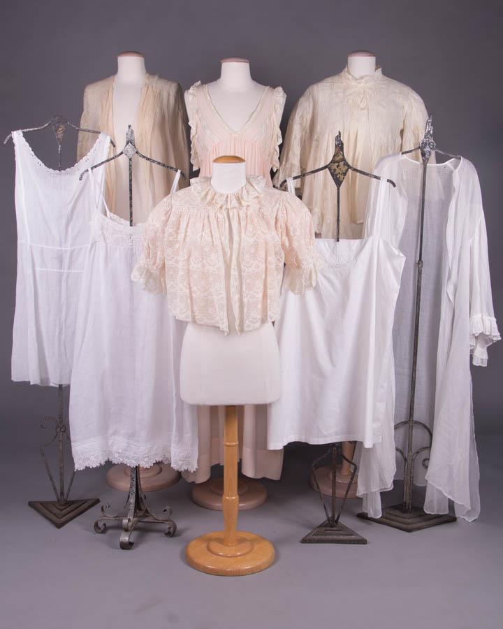 EIGHT PIECES OF LINGERIE, 1860 & 1920s: 3 bed jackets: 1 white lace w/ pink silk under layer, B 46", L 15.5"-18"; 1 white China silk godets & mm Val lace w/ cream under layer, B 47", L 23", (tiny-0.5" holes to lace, tears & holes lining); 1