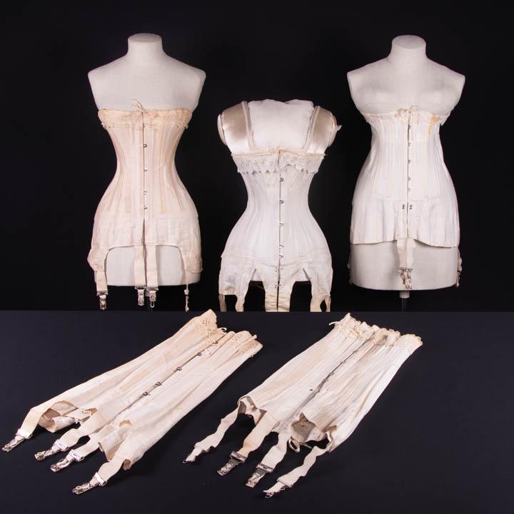 FOUR CORSETS, AMERICA, 1910s: 1 stamped "Lindsay, August 3, 1893, Flexible Felt Pat. Feb 20.06" & "PAT Mar.19.07 App'd For", B 32", W 23", L 18.5", (dirty, wear to W line, missing left side straps, missing grommets, bones poking t