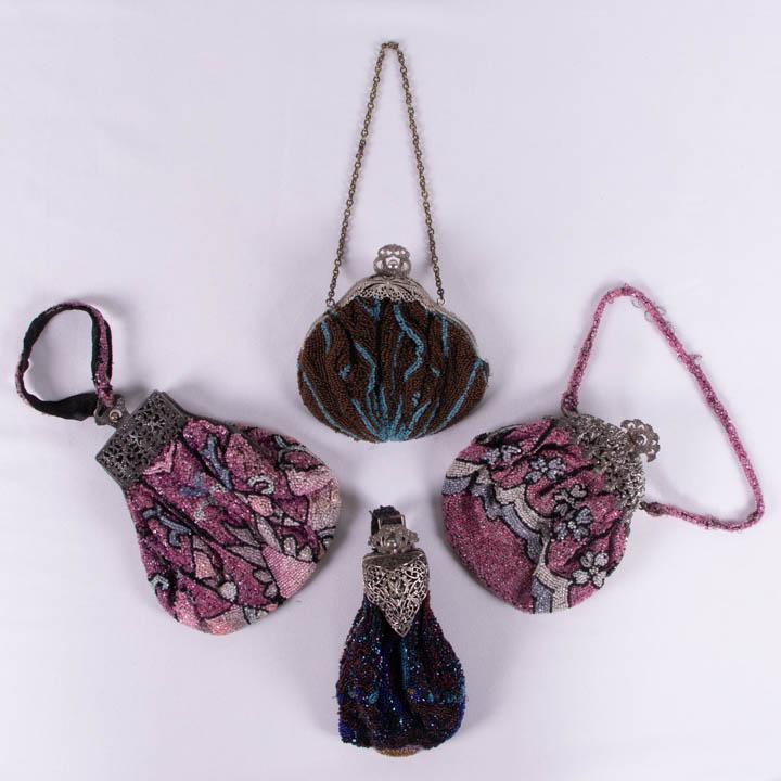 FOUR BEADED & NOUVEAU FRAME BAGS, 1910s: 1 interior colored crystal beads in shades of pink, blue & black w/ openwork frame in floral motif, stamped "Made is Czecho-Slovakia", 7.25"x5.5", (ribbon handle fraying, frame tarnished); 1 pink, blu