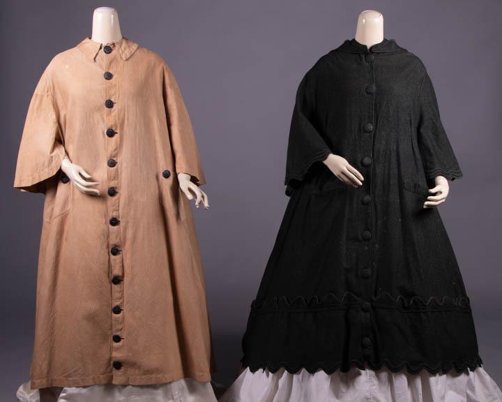 ONE DUSTER & ONE CLOAK, 1865-1867: 1 duster of tan textured & treated cotton w/ Peter Pan collar, CF gutta-percha button closure, incorporated dolman sleeve back cape, front H patch pockets w/ 2 decorative buttons, c. 1865, B 56", L 47