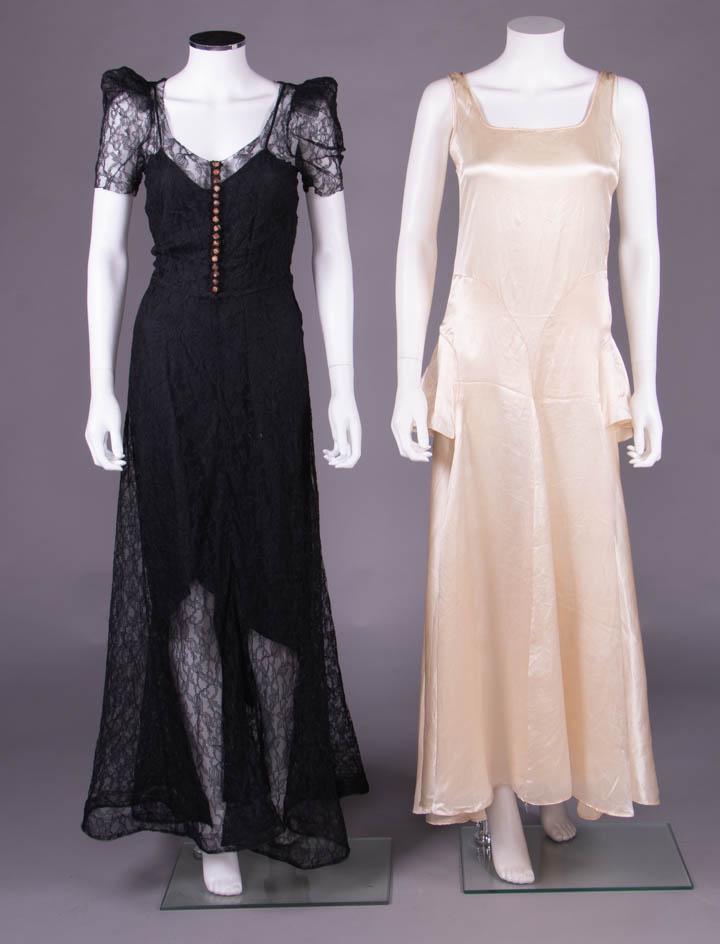 TWO EVENING GOWNS, 1930s: 1 black levers lace lingerie gown w/ buckram hem & structured SH, CF ecru silk & self-covered buttons, fitted bodice & bell shaped skirt, overdress only slip N/I, B 32", W 26", L 59", (staining to sil