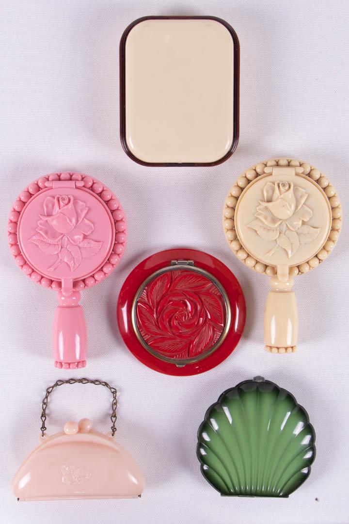 SIX COMPACTS, AMERICA, 1930-1940s: 1 cream & brown w/ mirror & brushes, 2.75" x 3.25" x 1", (scuffed, lightly dirty); 1 green scallop shell w/ mirror, lipstick & blush compartments, label "Elgin American", 2.75" x 3" x 0.75", (tarnish,