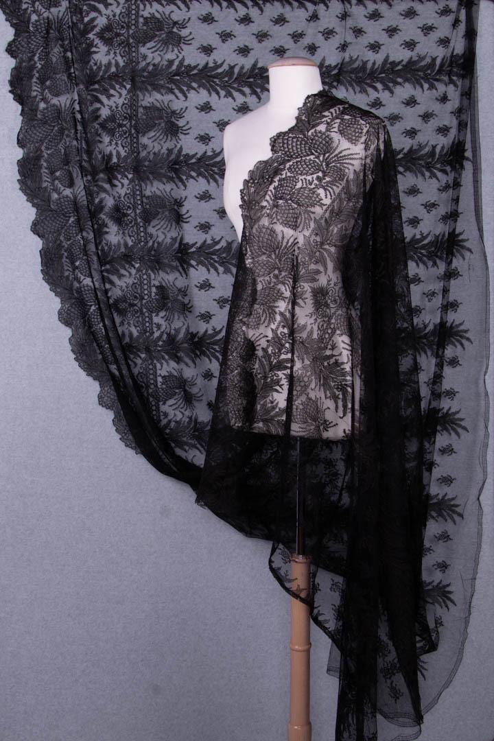 TWO LARGE CHANTILLY LACE FLOUNCE YARDAGE, MID 19TH C: Both of brown & black silk: 1 w/ all over floral grid & broad border in various crenelated Greek motifs, Wd 46", L 3+ yds, (raw ends, 0.25" hole in 1 edge near end) very good; 1 w/ leave stalks & berr