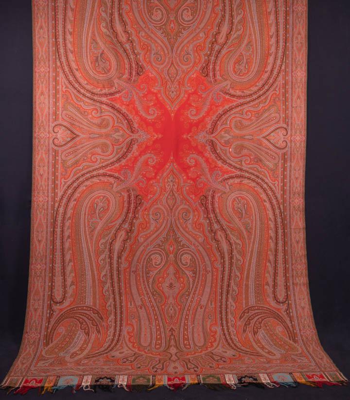 PAISLEY SHAWL, FRANCE, 1860-1870s: Wool & silk twill woven jacquard shawl w/ scarlet pattered center, densely patterned stylized boteh motifs, stylized borders & bands, silk self-warp fringe, French, 65" x 131", (small-1" paint stains 