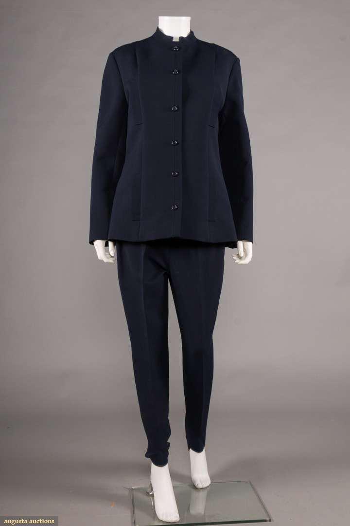 WOMAN'S SKI SUIT, WEST GERMANY, C. 1968: 2-pc long semi-fitted jacket & pants that fit under heel in navy wool synthetic blend, labeled "Queiller, Western Germany", B 40", W 31", Ins 29" all the way to heel, Jkt W 36", L 28", excellent. Muse
