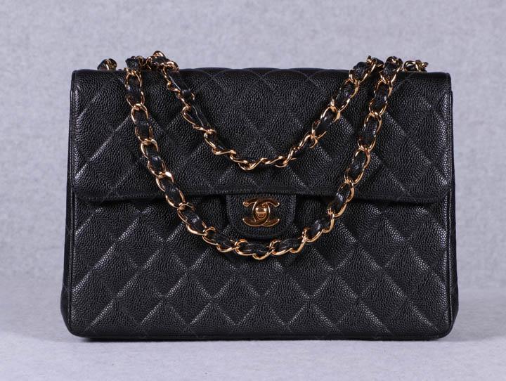 AUTHENTICATED CHANEL JUMBO CAVIAR QUILTED BAG, PARIS,: Unused jumbo handbag w/ classic single flap, black calfskin quilted leather, interwoven SH strap in gold tone chain & leather can be worn doubled up or as single strap, gold tone Chanel logo "CC" twis