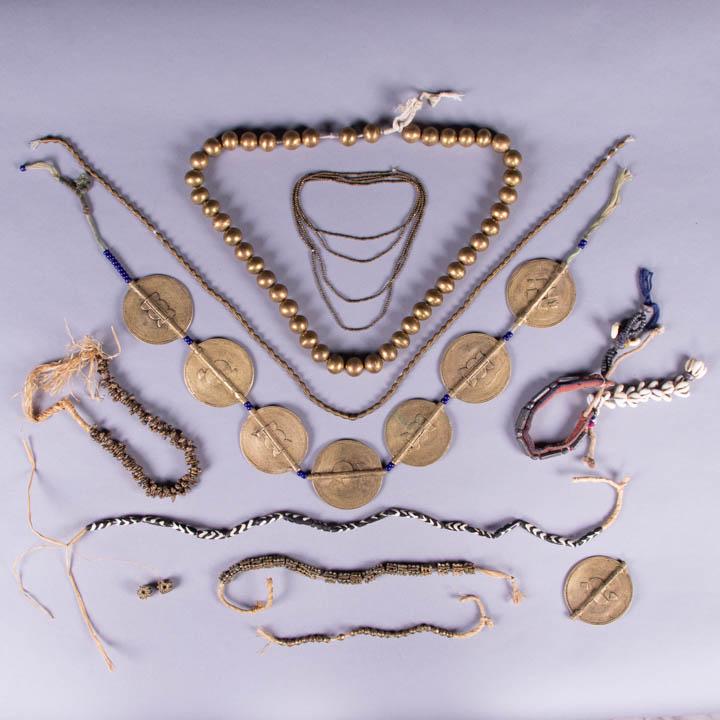 LARGE LOT OF AFRICAN BEADED JEWELRY: Most lost wax cast brass, some Benin, some Nigerian: 1 set of beads & necklace; 1 w/ metal discs & blue beads, Wd 0.25"-2.75", L 34.5", (blue beads & 1 disc detached & included, 1 disc chipped); 2 thi