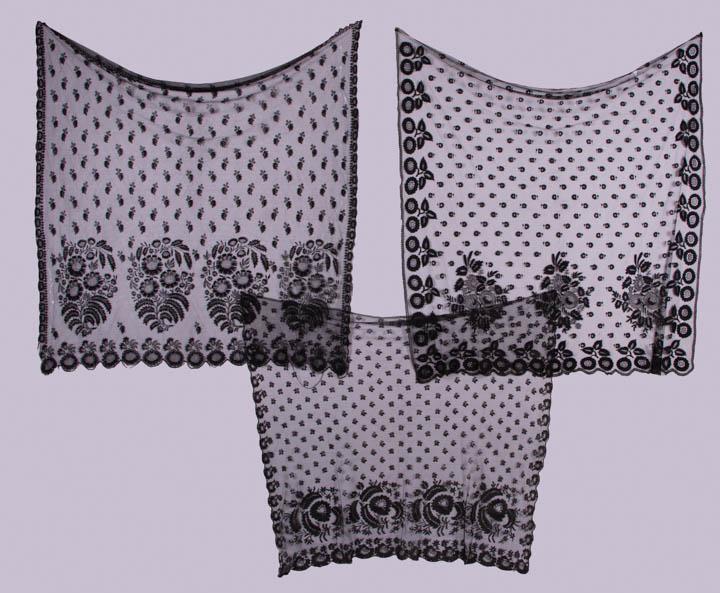 THREE BLACK EMBROIDERED BONNET VEILS, 1820-1840s: All needle lace running: 1 w/ dense flower rosettes at scalloped edge w/ needle lace trims, diagonal floral grid center, 51.5” x 52.5", (edges fraying, lots of tiny-0.5" holes, 0.75" & 2" holes, top