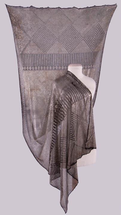 SILVER ASSUIT SHAWL, EARLY 20TH C: Black ground w/ silver assuit shawl, 38" x 86", (tarnished & oxidized metal scales, pulls at edges, 0.5" hole, 1"-6" strips of tarnish) fair.
