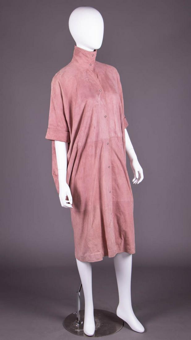 FENDI STYLIZED COCOON COAT, ROME, 1980s: Dusty rose suede coat w/ convertible funnel collar, t-shaped sleeve w/ turn back cuff at elbow, snap CF closure, extended back panels from inverted box pleat at neck to sides of seat, label "Fendi, Ro