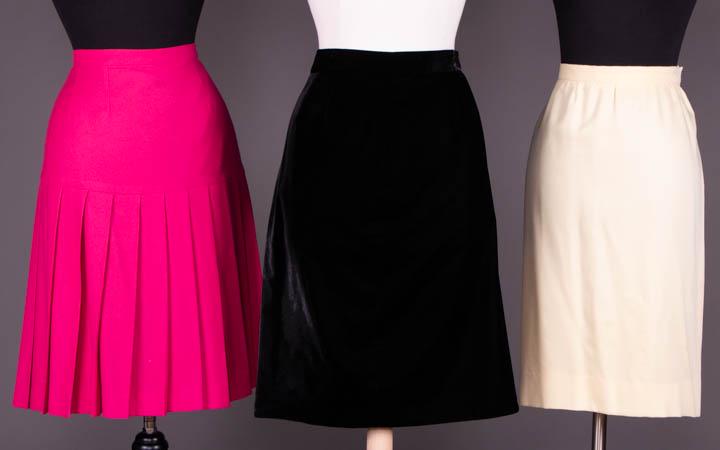 SIX DEMI-COUTURE SKIRTS & PRET-A-PORTET GIVENCHY SKIRTS: 1 shocking pink twill flannel skirt pleated into H yoke, "Boutiques Givenchy, Made in France, Paris", W 33", L 24.5", (spot stains); 1 black velvet, label "Couture Givenchy, Made in France, Paris", W