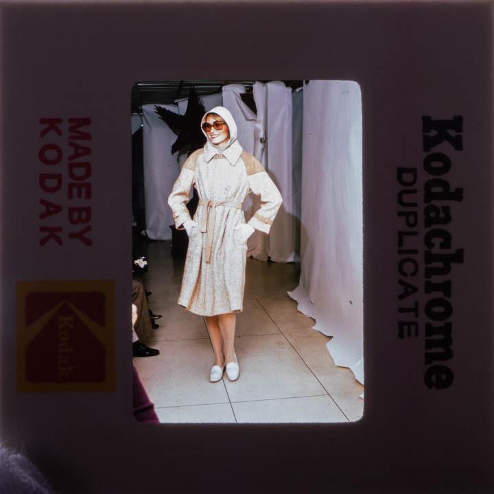 BONNIE CASHIN COAT W/ PATTERN, SKETCH & SLIDES, 1976: Silk & wool basket weave overcoat w/ tan suede SH patches, belt buckle closure at throat & as decorative element on sleeves, tan suede tie belt, CF hidden brass snap closures, single deep box pleat fr