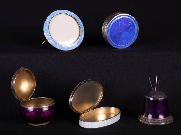 FIVE ENAMEL TABLE ACCESSORIES, EARLY 20TH C: 1 aubergine guillochÃ© enamel pin holder, 1.875" x 1.625", (0.5" x 1" of sticky residue base, cushion worn); 1 spherical aubergine guillochÃ© enamel box, stamped â€œGV & Co., 925”, 2&rdq