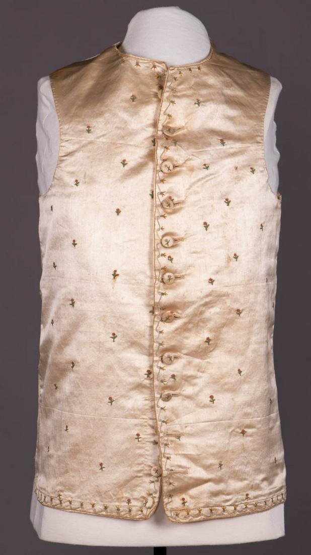 SILK POINT DE CHAINETTE EMBROIDERED WAISTCOAT, 1788: Point de chainette embroidered in rosebud motif on white silk waistcoat, pre-embroidered, glazed wool calamanco lining edged with linen, France, CH 37", W 37", L 22.5", (stains/discoloration, red thre