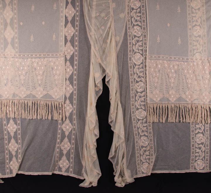 FOUR TAMBOUR EMBROIDERED CURTAINS OR BED COVERINGS: C 1900, 2 matching satin stitch embroidered & tambour net curtains, both w/ 8” fringe: 1 curtain 31" x 76" & 1 curtain, 32" x 79”, (both w/ messy fringe, light wear, unfinished ends raw) g
