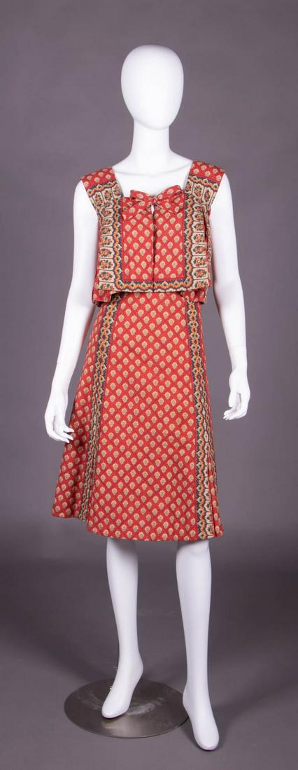 CHARLES DEMERY TWO PIECE OUTFIT, FRANCE, 1970s: 2-pc ensemble c/o sleeveless crop top w/ free front & CF self-ties & matching skirt in traditional Provencal resist dyed & printed cotton w/ overall floral grid & border patterns to gathered godets & 
