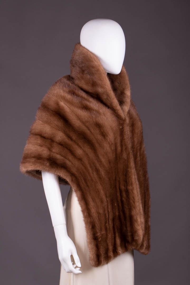 SCHIAPARELLI MINK STOLE, FRANCE, 1950s: Collared & caped stole, cafe au lait silk lining w/ woven Schiaparelli signature, label "Schiaparelli Paris" & "The Broadway Southern California", SH-SH 18", L 19"-29.5", (fur pressed against grain in