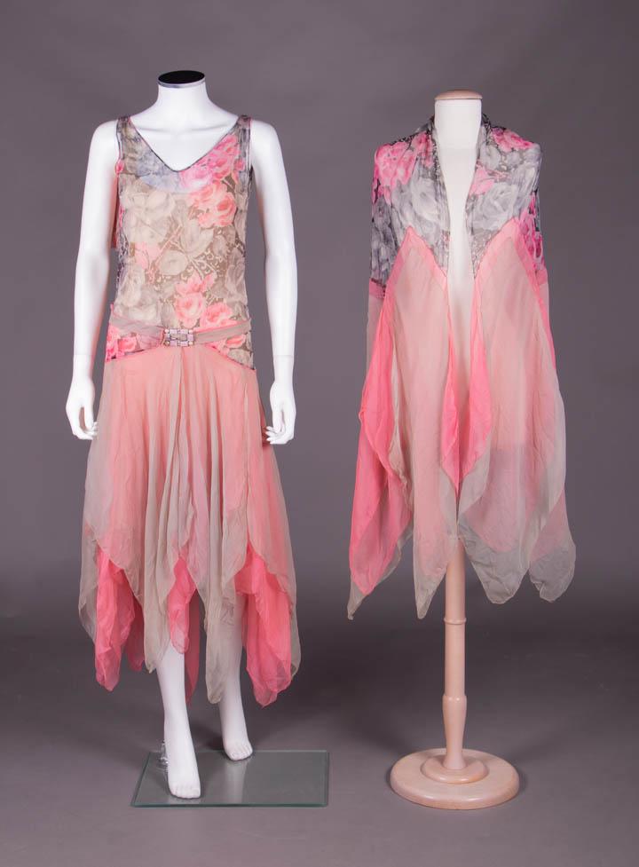 CREPE CHIFFON PARTY ENSEMBLE, 1920s: Party dress w/ bodice of printed crepe chiffon in rose motif w/ layered handkerchief hem line, draped belt & ends shawl of bubblegum pink & dove grey floral print, CF buckle w/ faux pearls & rhineston